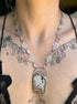 Butterfly Necklace with a pendant worn by a person with tattoos on their neck.